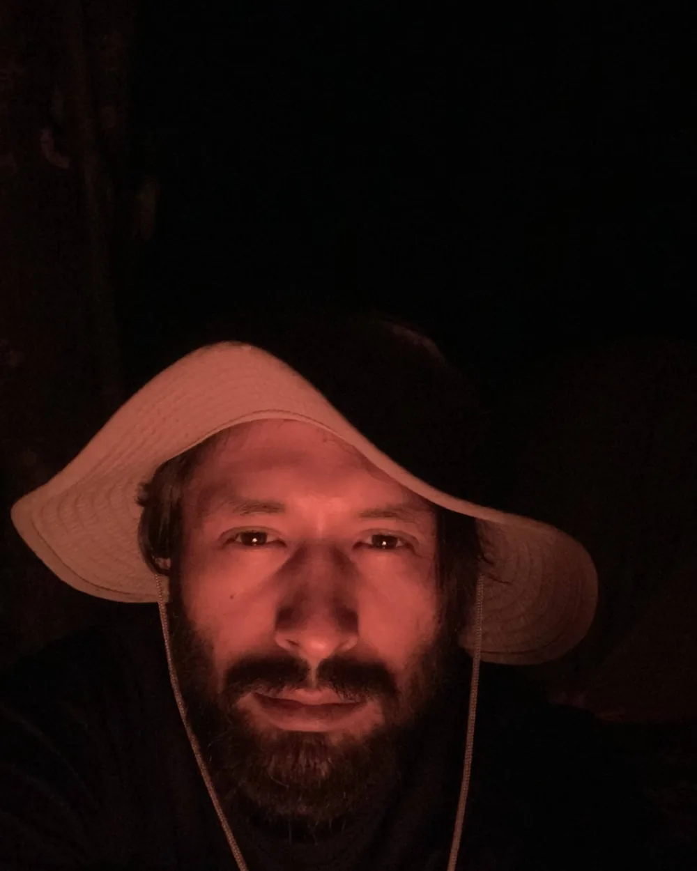 Khem Raj Pradhan reading in the Nepal Himalaya