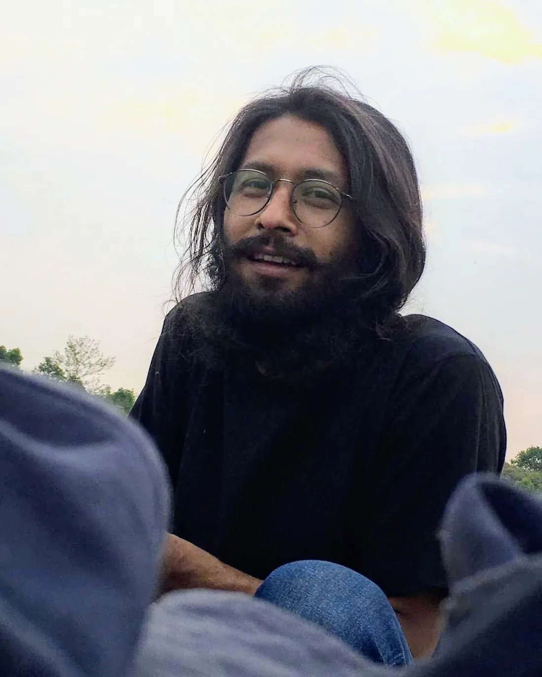 Khem Raj Pradhan in profile before a Himalayan peak